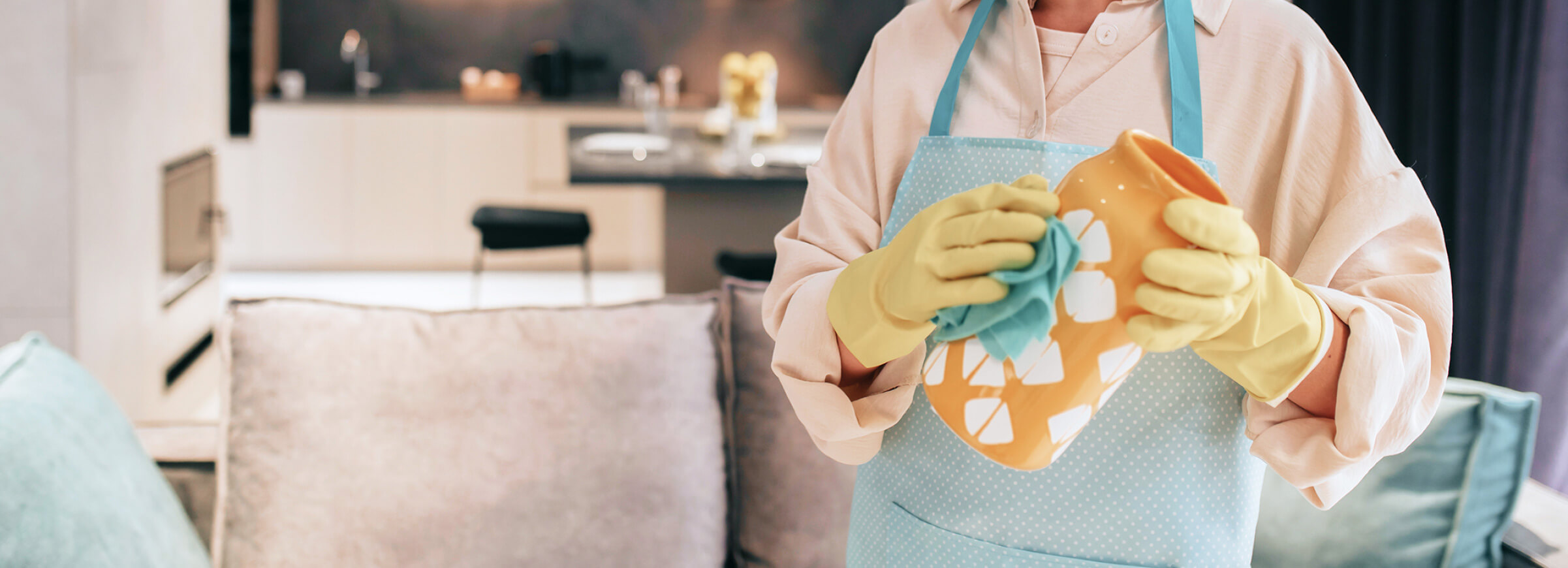 woman cleaning vase